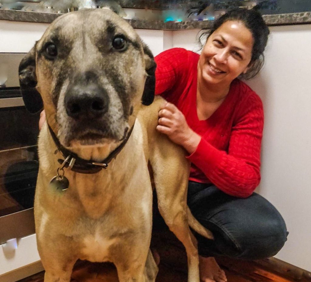 A photograph of Dilrukshi Mendis (the visual storyteller) and Pawlick Bones (the big dog and my muse)