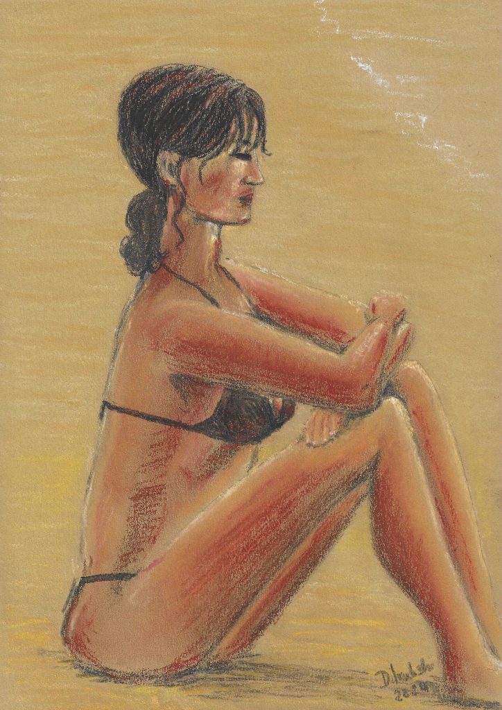 A woman in a black bikini sits with eyes closed and arms folded over her knees in the sunshine on a beach